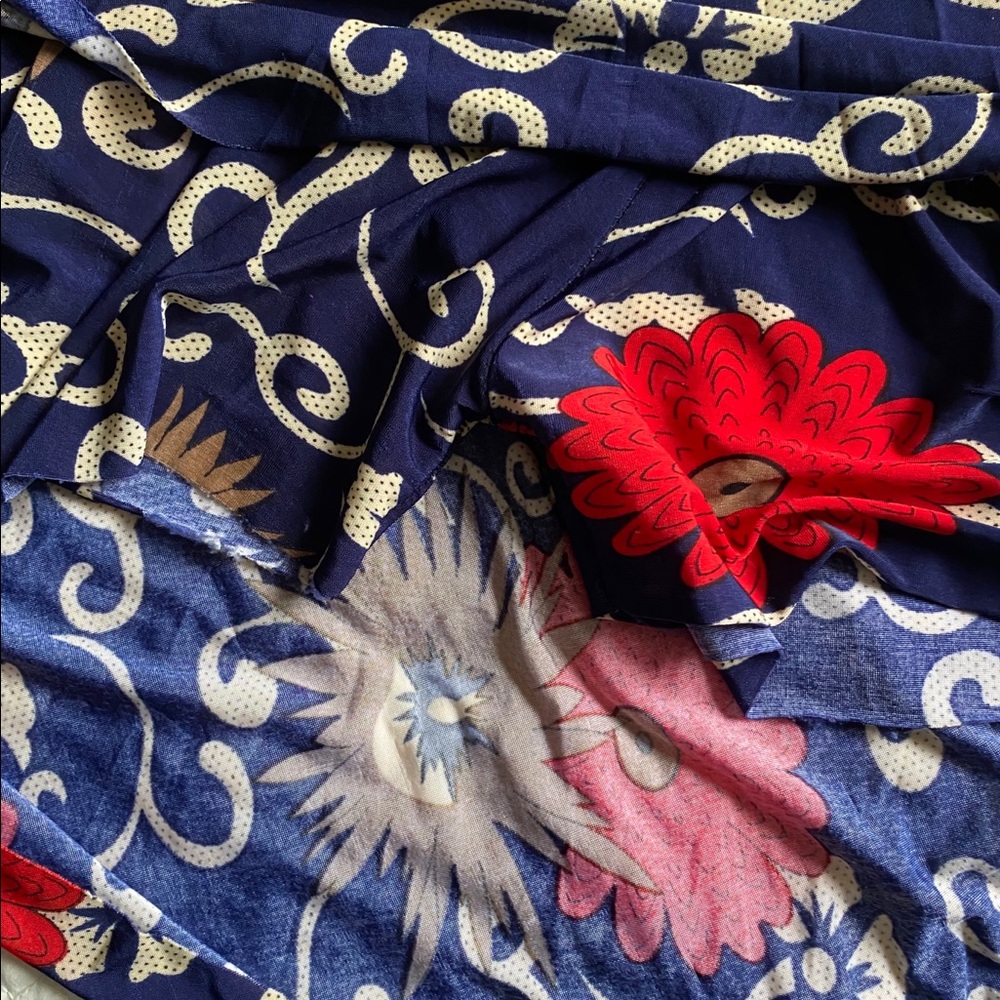 Red, blue and tan flare skirt with elastic waist.